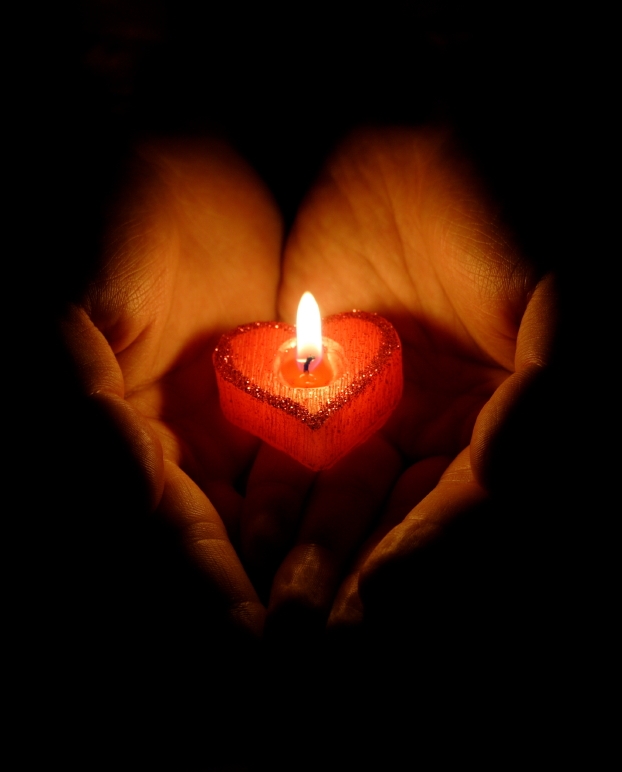 iStock_000007656438Small-Burning-Heart-Candle-w-Hands